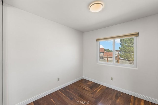 37338 Salem Ct, Palmdale, CA 93550 - spare room featuring baseboards and dark wood-type flooring