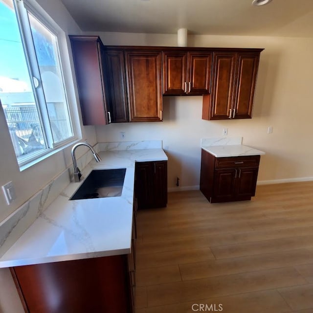 3765 Globe Ave, Los Angeles, CA 90066 - kitchen with light wood finished floors and dark brown cabinets