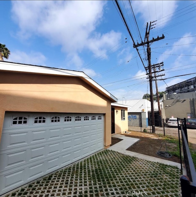 3765 Globe Ave, Los Angeles, CA 90066 - view of home's exterior featuring stucco siding and a garage