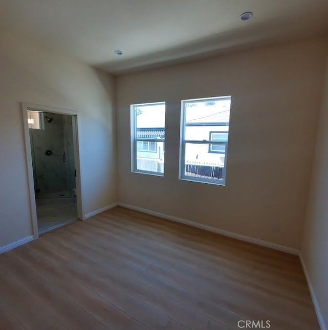 3765 Globe Ave, Los Angeles, CA 90066 - unfurnished bedroom featuring wood finished floors and baseboards