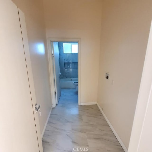 3765 Globe Ave, Los Angeles, CA 90066 - corridor featuring light marble finish floors and baseboards
