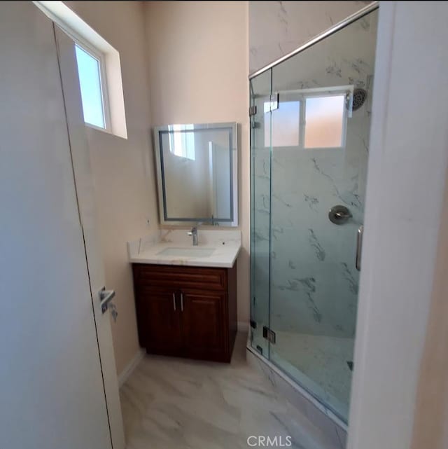 3765 Globe Ave, Los Angeles, CA 90066 - full bathroom featuring plenty of natural light, vanity, and a marble finish shower