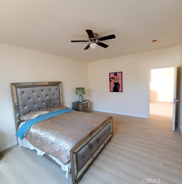 3765 Globe Ave, Los Angeles, CA 90066 - bedroom with light wood-style floors and a ceiling fan