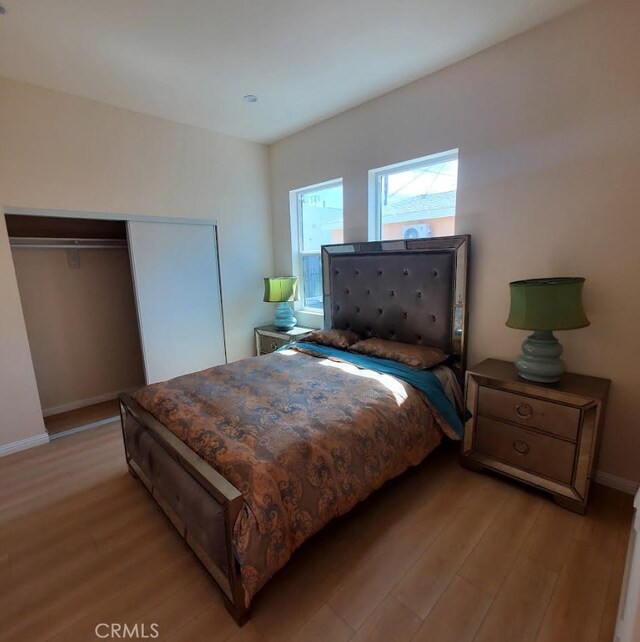 3765 Globe Ave, Los Angeles, CA 90066 - bedroom with light wood-type flooring and a closet