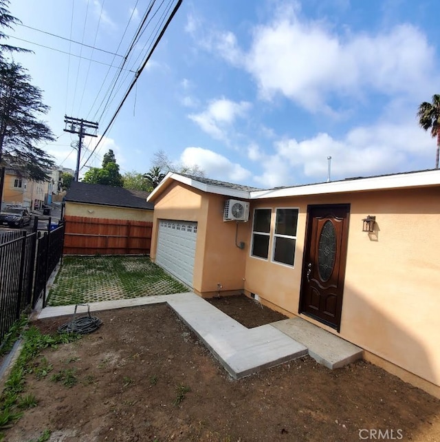 3765 Globe Ave, Los Angeles, CA 90066 - entrance to property featuring stucco siding and a wall mounted air conditioner