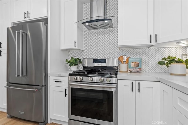 32772 Shipside Dr, Dana Point, CA 92629 - kitchen featuring stainless steel appliances, wall chimney exhaust hood, white cabinetry, and decorative backsplash