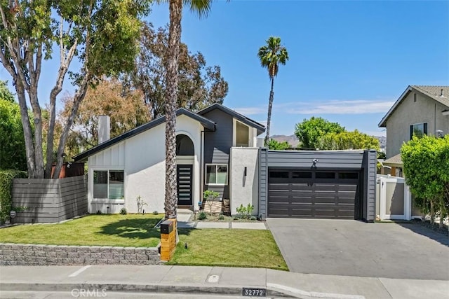 32772 Shipside Dr, Dana Point, CA 92629 - mid-century inspired home featuring an attached garage, driveway, and stucco siding