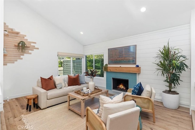 32772 Shipside Dr, Dana Point, CA 92629 - living area featuring wood finished floors, a tiled fireplace, high vaulted ceiling, stairway, and recessed lighting