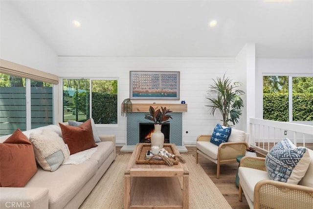 32772 Shipside Dr, Dana Point, CA 92629 - living room featuring wood finished floors, plenty of natural light, recessed lighting, a lit fireplace, and vaulted ceiling