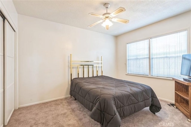 1908 W 134th Pl, Gardena, CA 90249 - bedroom featuring carpet, a textured ceiling, ceiling fan, and a closet