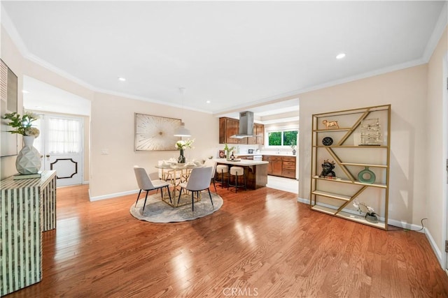20158 Barnard Ave, Walnut, CA 91789 - dining room featuring light wood-style floors, crown molding, and recessed lighting