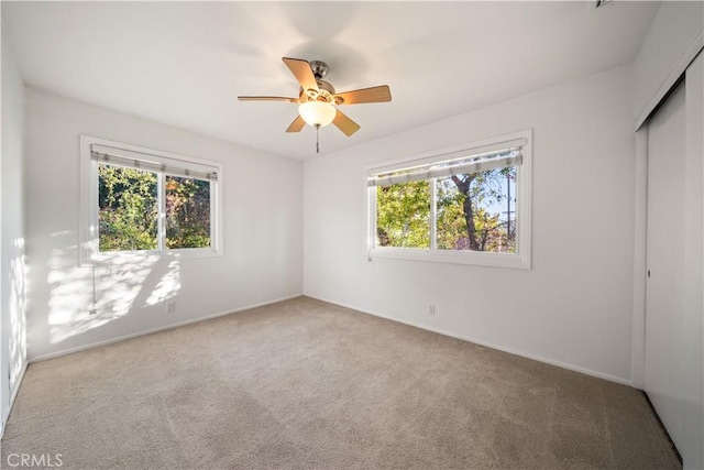 20158 Barnard Ave, Walnut, CA 91789 - unfurnished bedroom with multiple windows, carpet floors, a closet, and a ceiling fan