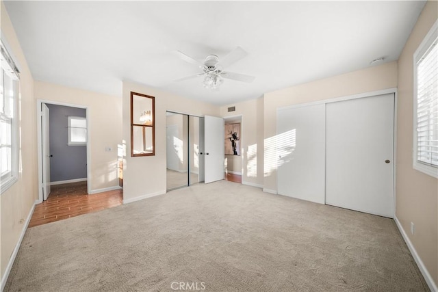 20158 Barnard Ave, Walnut, CA 91789 - unfurnished bedroom featuring carpet floors, multiple closets, multiple windows, and a ceiling fan
