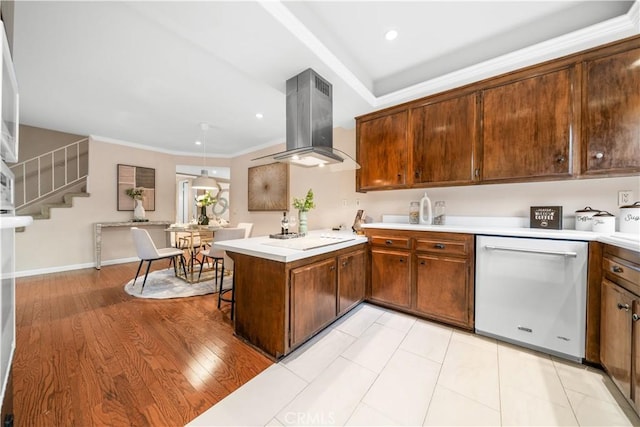 20158 Barnard Ave, Walnut, CA 91789 - kitchen with dishwasher, island exhaust hood, electric cooktop, a peninsula, and light countertops