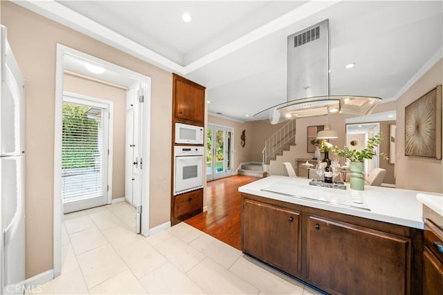 20158 Barnard Ave, Walnut, CA 91789 - kitchen featuring white appliances, plenty of natural light, light countertops, crown molding, and open floor plan