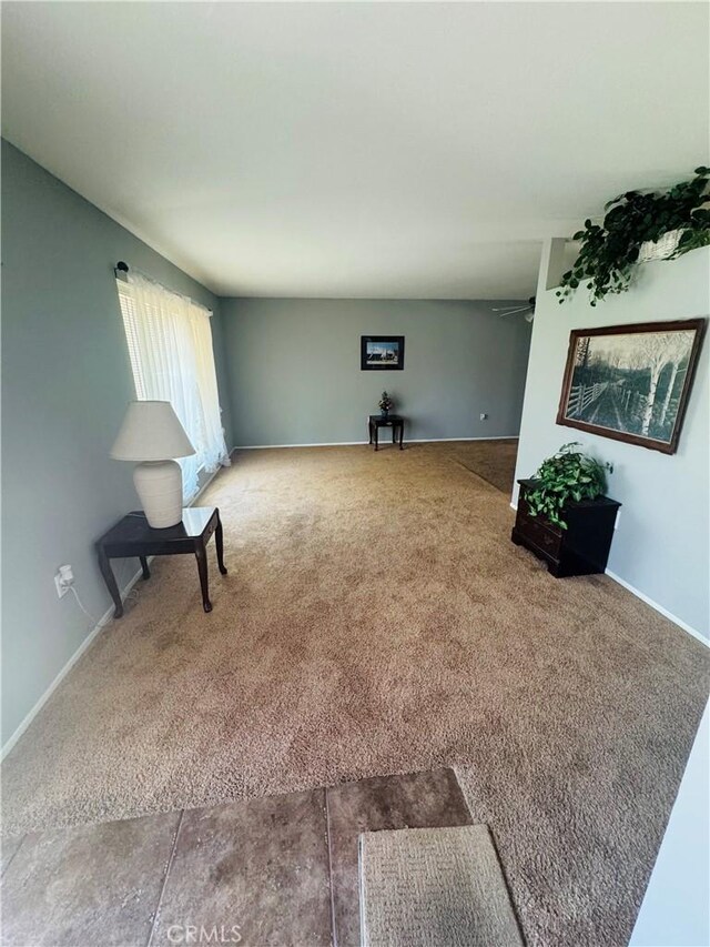 27102 Capilano Dr, Menifee, CA 92586 - unfurnished living room featuring carpet flooring and a ceiling fan