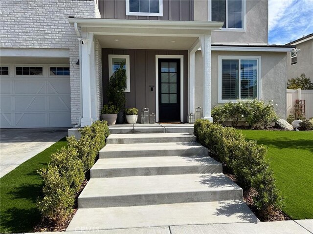 28524 Songbird Way, Saugus, CA 91350 - doorway to property featuring board and batten siding, brick siding, and driveway