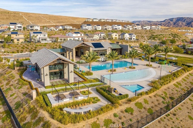 28524 Songbird Way, Saugus, CA 91350 - aerial perspective of suburban area with a pool area and a mountain backdrop
