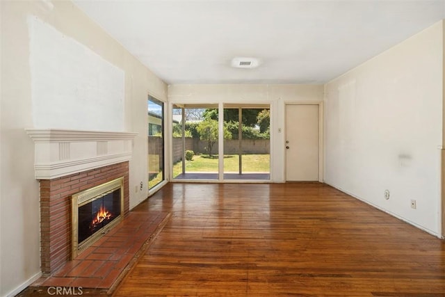 2729 N Studebaker Rd, Long Beach, CA 90815 - unfurnished living room featuring wood finished floors and a fireplace