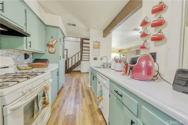 77 Meadow Lakes Dr, Tehachapi, CA 93561 - kitchen with white appliances, green cabinetry, light countertops, light wood-style floors, and backsplash