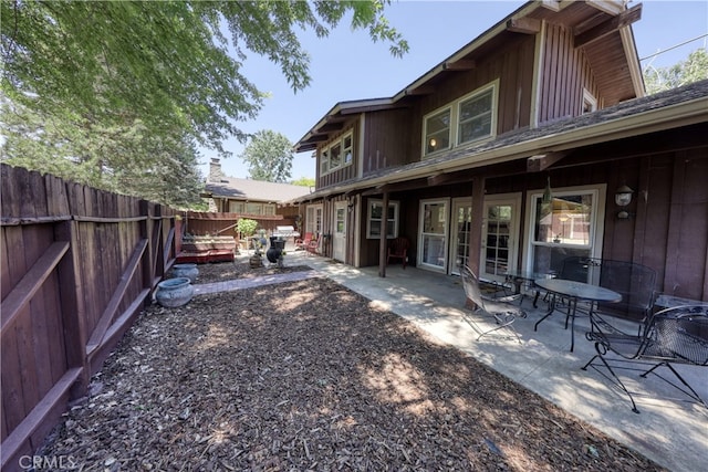 77 Meadow Lakes Dr, Tehachapi, CA 93561 - back of house with a fenced backyard and a patio area