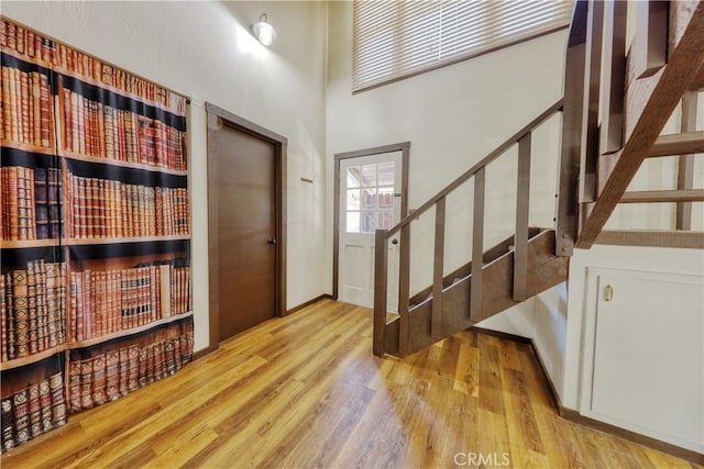 77 Meadow Lakes Dr, Tehachapi, CA 93561 - foyer entrance with stairs, wood finished floors, and a towering ceiling