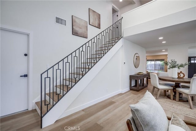 14632 Kimberly Cir, Tustin, CA 92780 - stairway featuring wood finished floors, recessed lighting, and a high ceiling