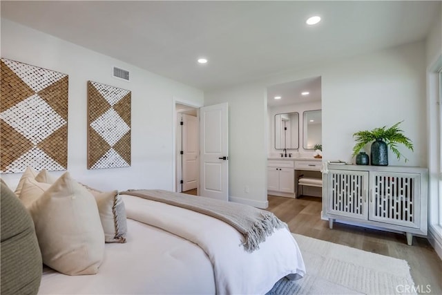 14632 Kimberly Cir, Tustin, CA 92780 - bedroom with wood finished floors, connected bathroom, and recessed lighting