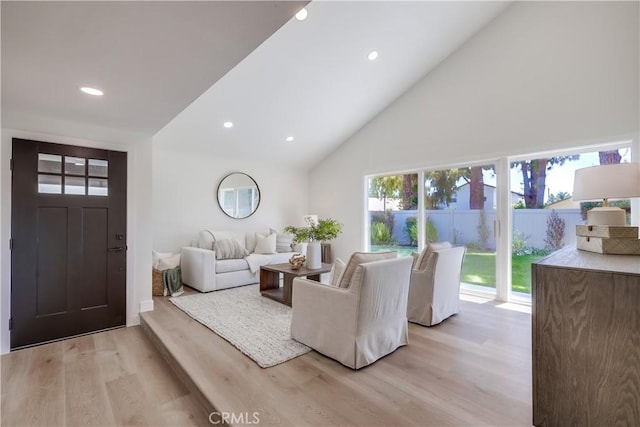 14632 Kimberly Cir, Tustin, CA 92780 - living area featuring light wood-style floors, recessed lighting, and high vaulted ceiling