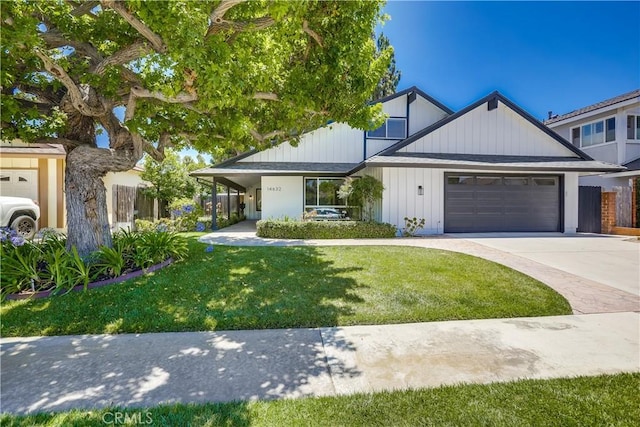 14632 Kimberly Cir, Tustin, CA 92780 - view of front of home featuring a garage, a front lawn, and driveway