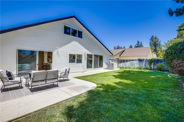 14632 Kimberly Cir, Tustin, CA 92780 - back of property featuring stucco siding, outdoor lounge area, and a patio