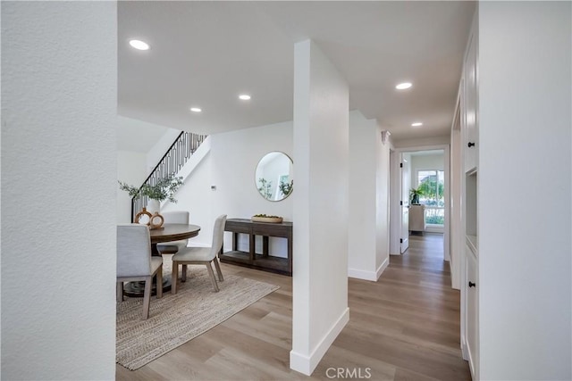 14632 Kimberly Cir, Tustin, CA 92780 - hall featuring light wood-style floors, stairs, and recessed lighting