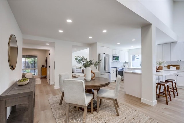 14632 Kimberly Cir, Tustin, CA 92780 - dining area with light wood finished floors and recessed lighting