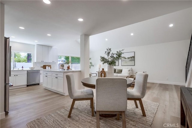 14632 Kimberly Cir, Tustin, CA 92780 - dining area with light wood-style flooring and recessed lighting