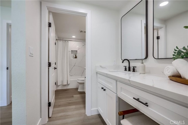14632 Kimberly Cir, Tustin, CA 92780 - bathroom featuring vanity, wood finished floors, shower / tub combo with curtain, and recessed lighting