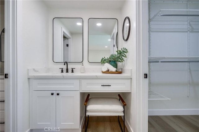 14632 Kimberly Cir, Tustin, CA 92780 - bathroom with wood finished floors, vanity, and recessed lighting