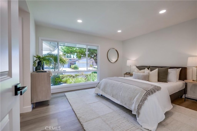 14632 Kimberly Cir, Tustin, CA 92780 - bedroom with recessed lighting and light wood-style floors