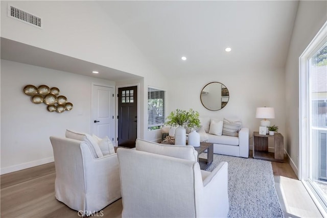 14632 Kimberly Cir, Tustin, CA 92780 - living area with light wood finished floors, lofted ceiling, and recessed lighting