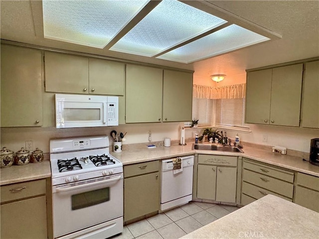 512 E Clinton Ave, Atwater, CA 95301 - kitchen with white appliances, light countertops, and light tile patterned floors