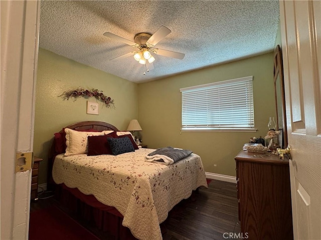 512 E Clinton Ave, Atwater, CA 95301 - bedroom featuring dark wood-type flooring, a textured ceiling, and a ceiling fan