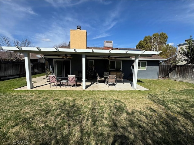 512 E Clinton Ave, Atwater, CA 95301 - back of house with a ceiling fan, a fenced backyard, a chimney, and a patio