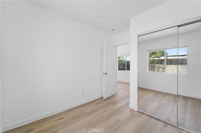 18656 Runnymede St, Reseda, CA 91335 - unfurnished bedroom featuring light wood-type flooring and a closet