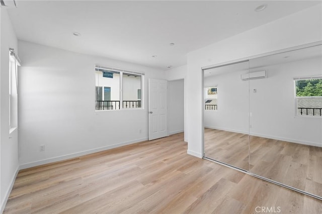 18656 Runnymede St, Reseda, CA 91335 - spare room with wood finished floors and a wall mounted air conditioner