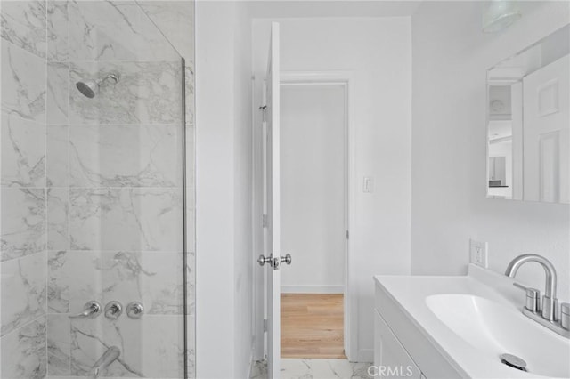 18656 Runnymede St, Reseda, CA 91335 - full bathroom with a marble finish shower, vanity, and marble look tile flooring