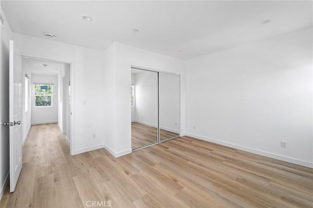 18656 Runnymede St, Reseda, CA 91335 - unfurnished bedroom featuring light wood-type flooring and a closet