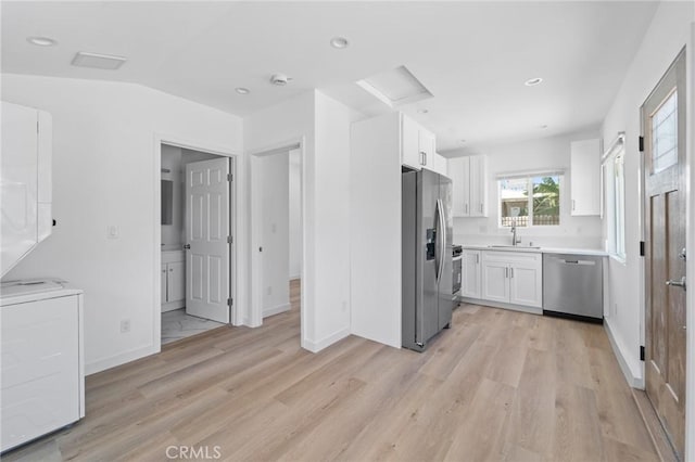 18656 Runnymede St, Reseda, CA 91335 - kitchen featuring appliances with stainless steel finishes, white cabinetry, light wood finished floors, and recessed lighting
