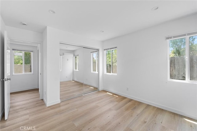 18656 Runnymede St, Reseda, CA 91335 - unfurnished bedroom with multiple windows, light wood finished floors, and recessed lighting