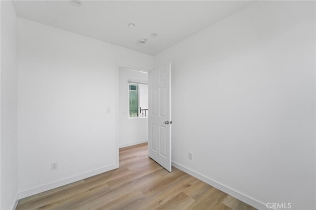 18656 Runnymede St, Reseda, CA 91335 - empty room with light wood finished floors and baseboards