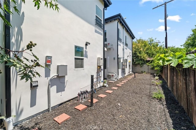 18656 Runnymede St, Reseda, CA 91335 - view of side of home featuring stucco siding and a fenced backyard