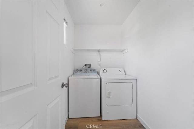 18656 Runnymede St, Reseda, CA 91335 - washroom featuring washing machine and dryer and wood finished floors